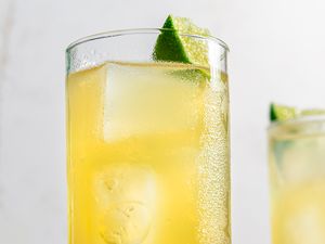 Mezcal Shandy cocktails garnished with lime slices