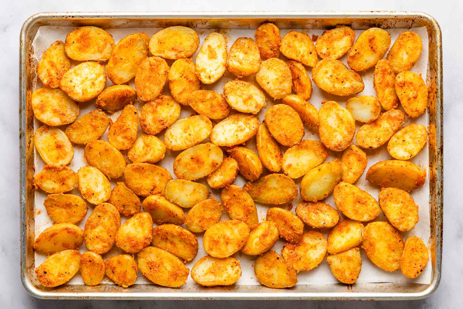 bang bang potatoes added to the baking tray (not baked)