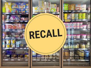 A supermarket freezer aisle with a large circular label Overlaid with Recall in bold text