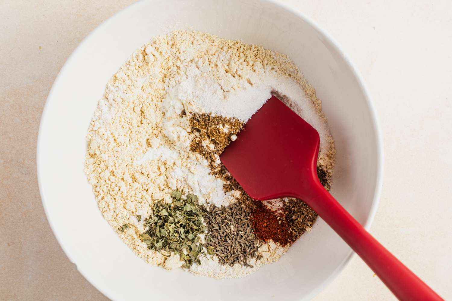 Bowl of Besan, Corn Starch, and Spices for Delicata Squash Pakoras Recipe