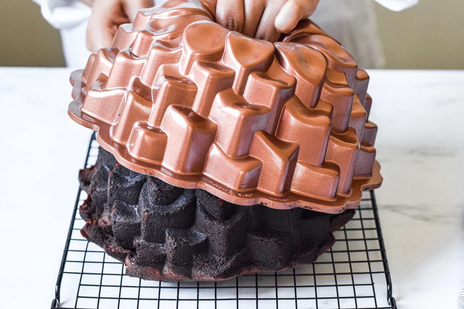 Unmolding a Chocolate Bourbon Cake from a bundt pan