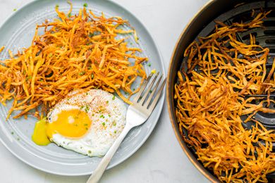 Air Fryer Hash Browns on a Plate with a Sunny Side Egg and in an Air Fryer Basin