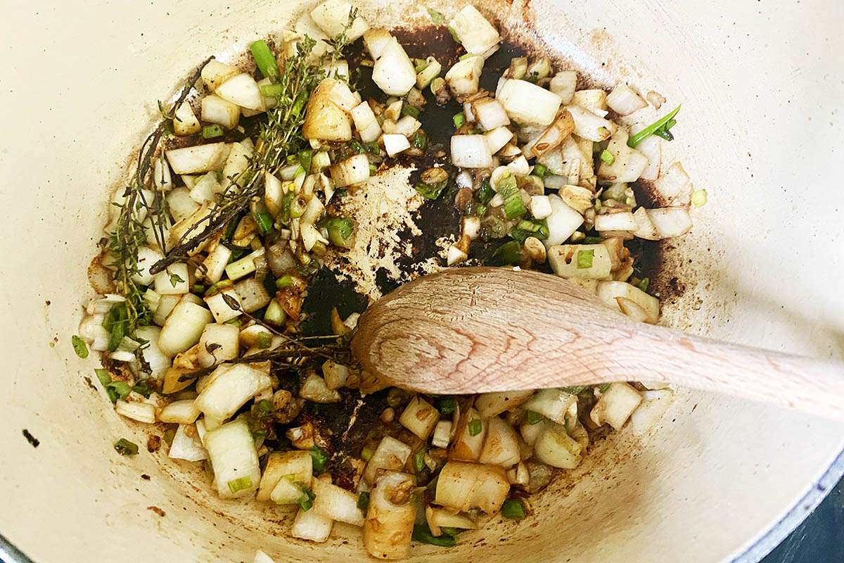 Sauce and aromatics sauteed in the bottom of a dutch oven to make Jamaican Stewed Beef.
