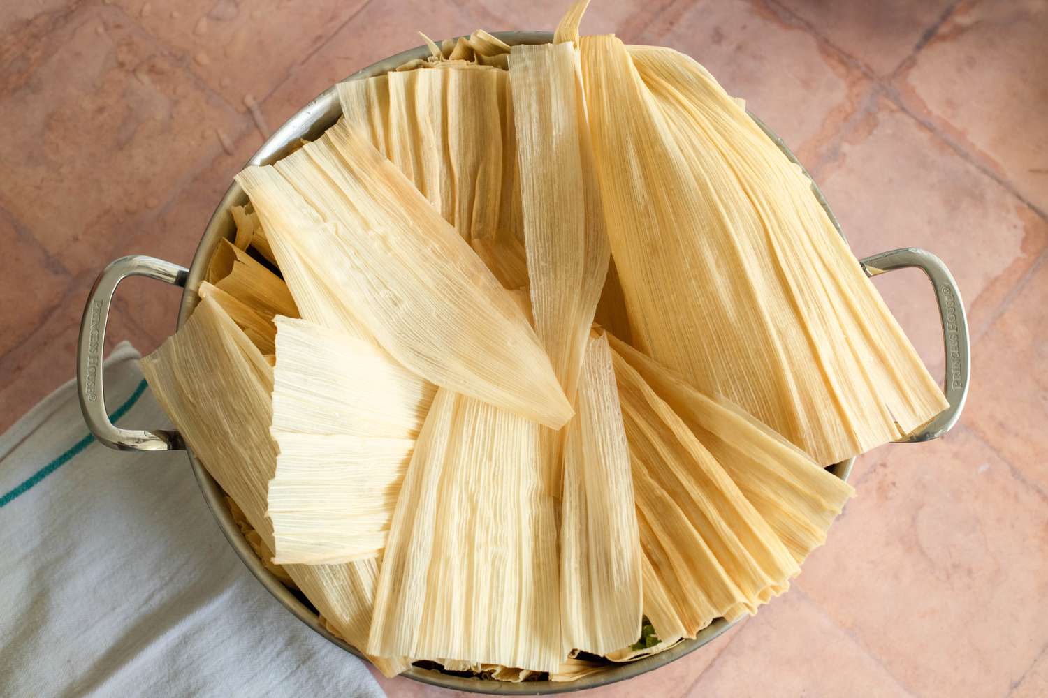 Tamales in Steamer Covered in Corn Husks