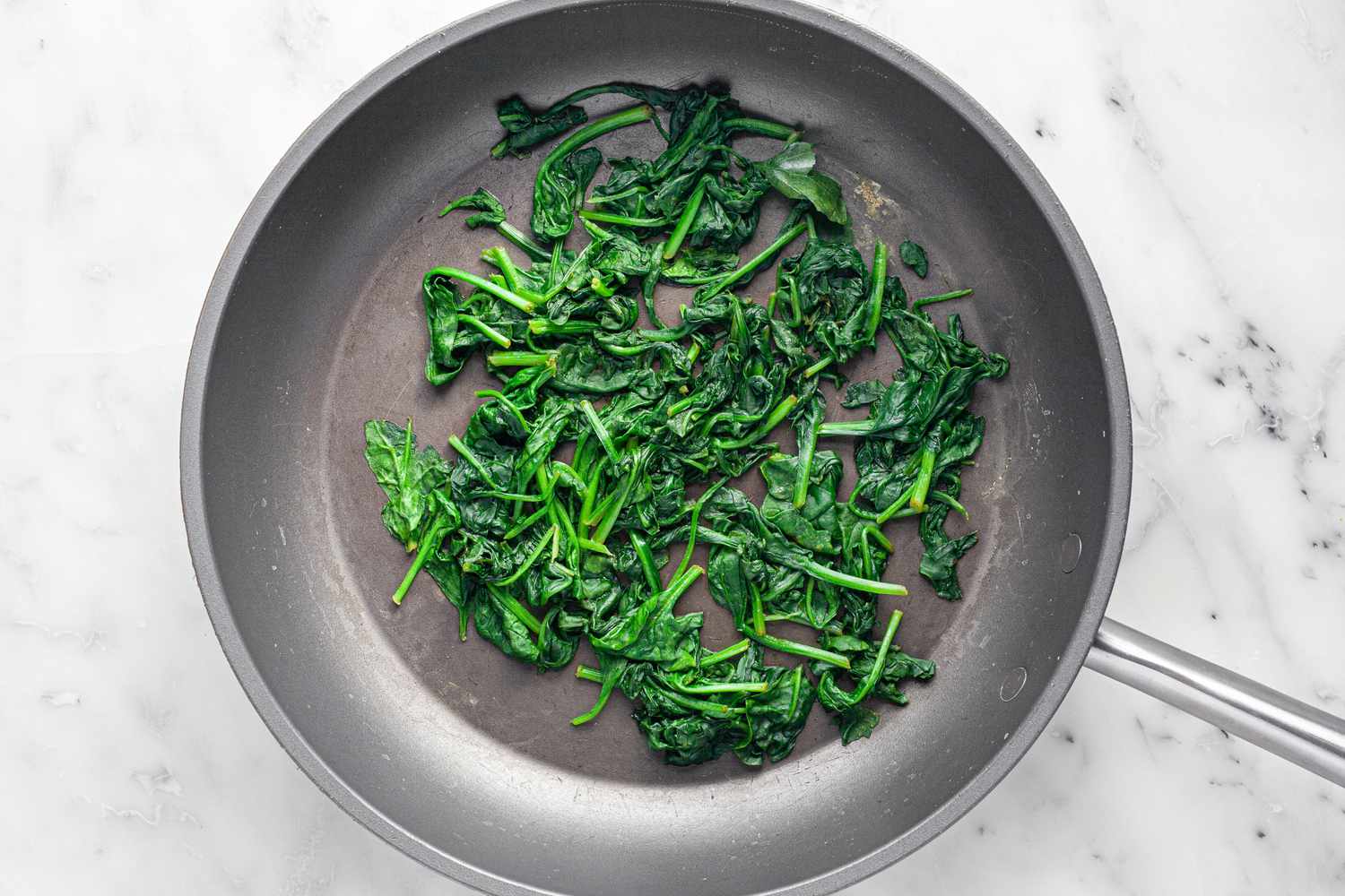 Baby Spinach Cooked in a Pan for Chicken Lasagna Recipe