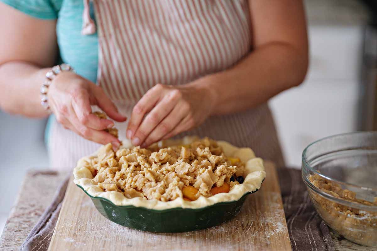 Peach and blueberry pie recipe fill the top with crumbs