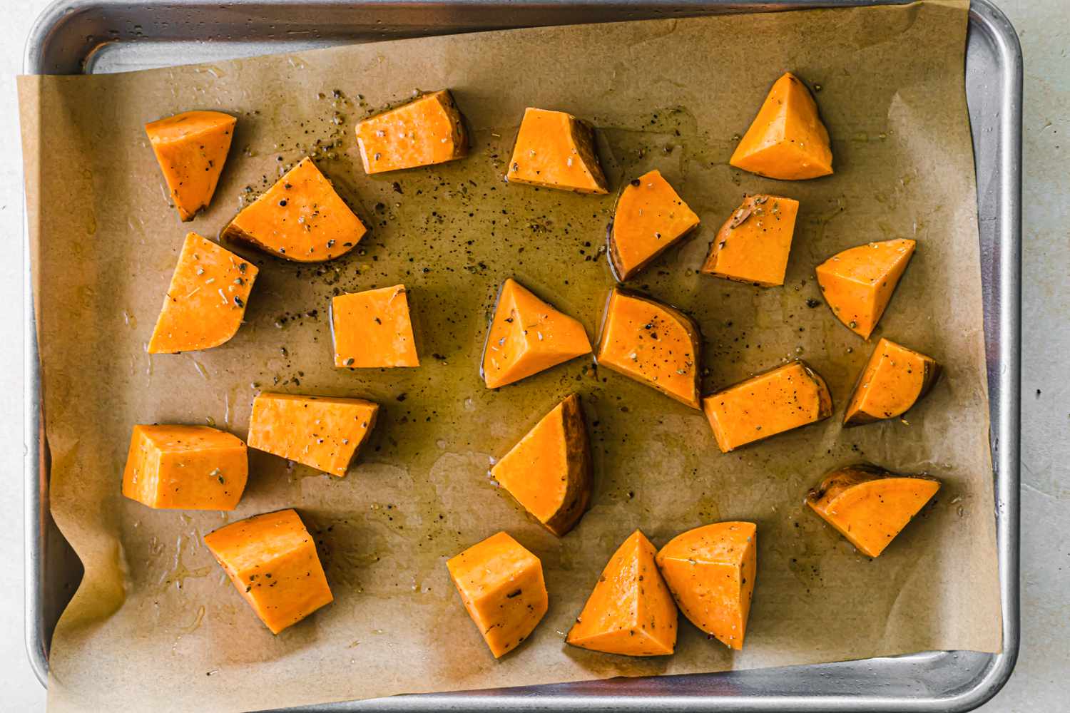 Cut sweet potatoes on parchment how to roast any vegetable