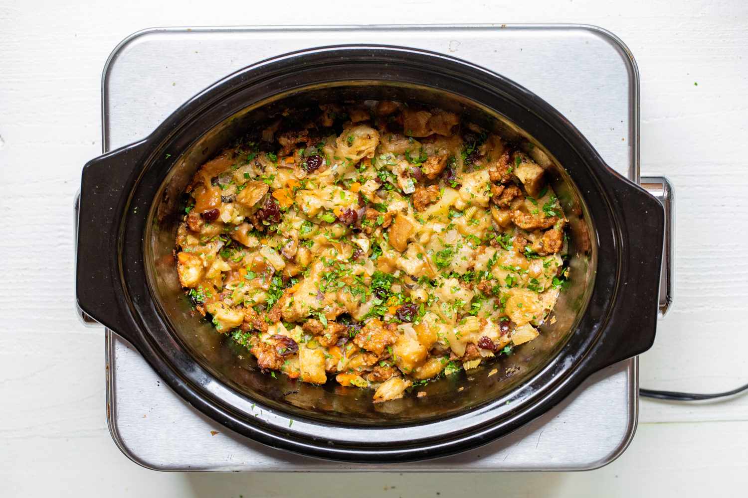 Slow Cooker Stuffing Topped with Minced Herbs