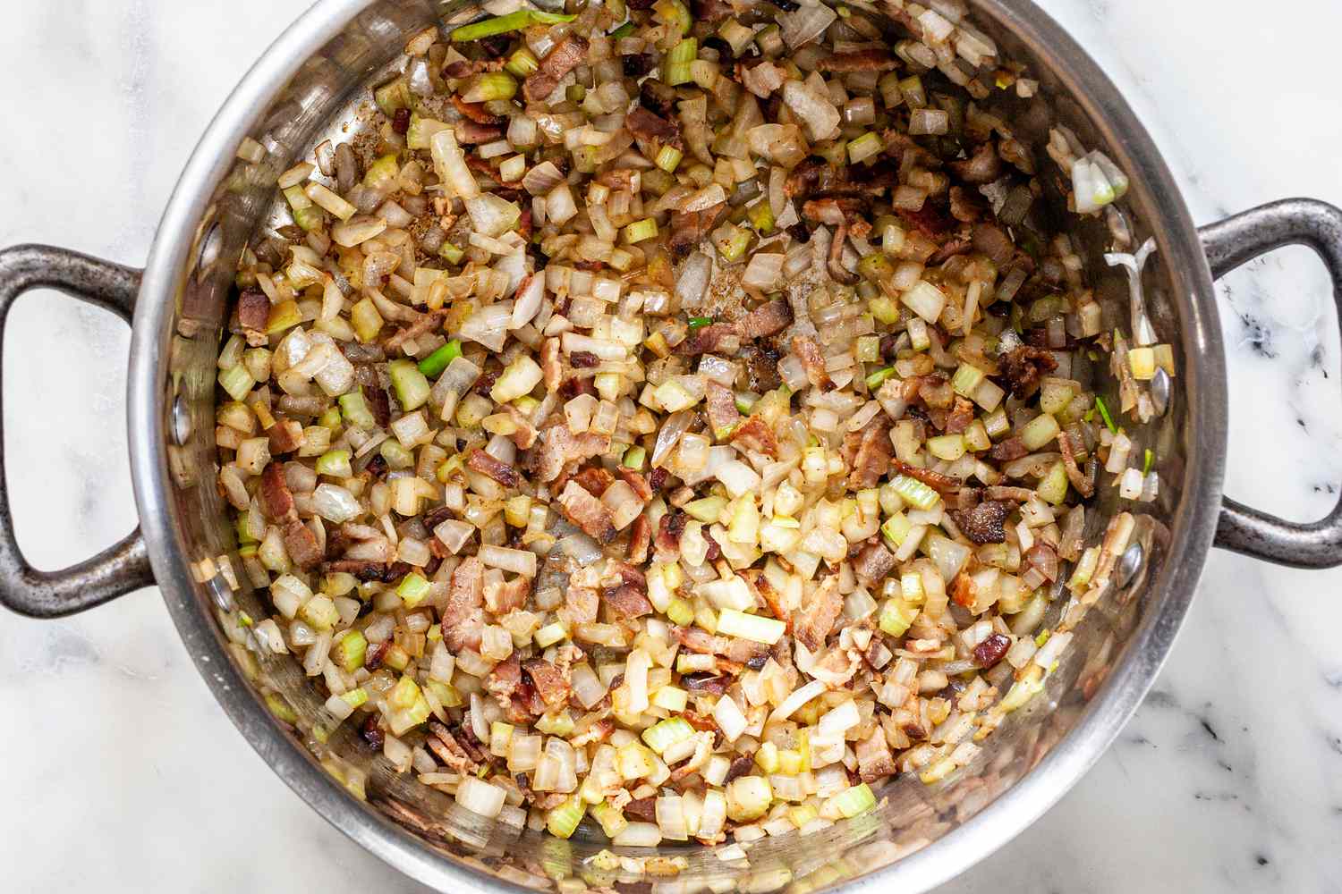 Minced Vegetables Added to Pot for Classic New England Chowder Recipe