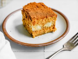 Slice of Pumpkin Tiramisu on a Plate Next to a Fork