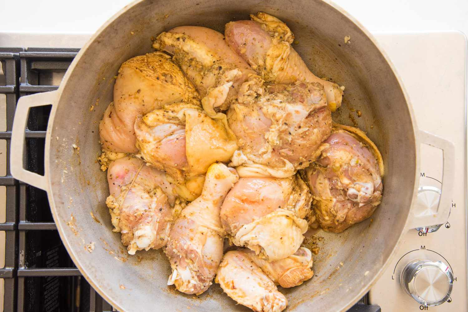 Chicken Added to Caldero for Pollo Guisado