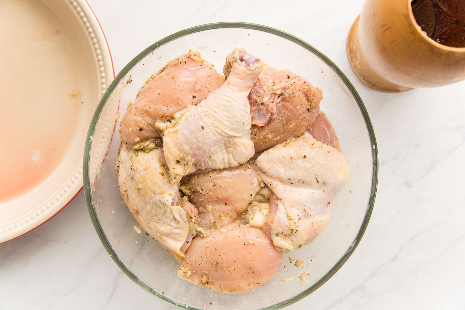 Chicken Pieces Marinating in the Garlic-Lemon Paste for Pollo Guisado Recipe