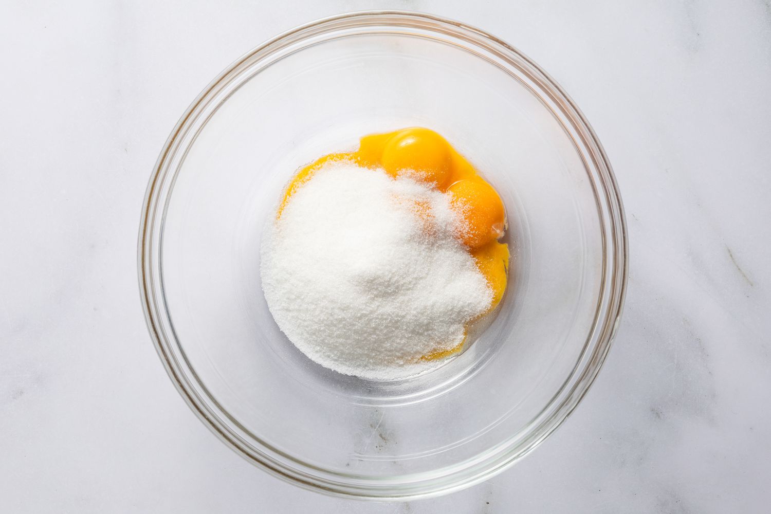 bowl of egg yokes and sugar for magic cake (gÃ¢teau magique) recipe