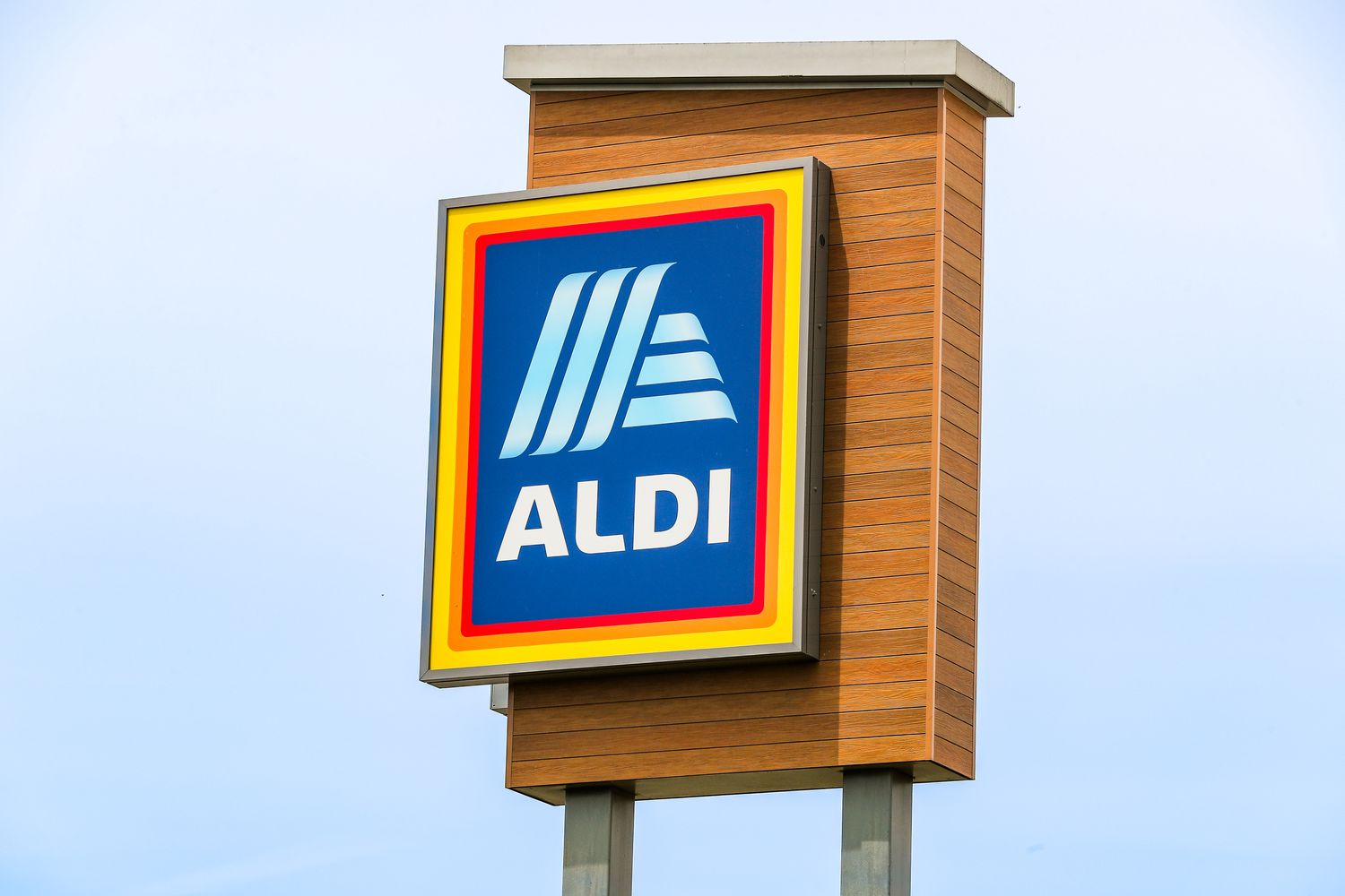 The logo of Aldi is displayed on a sign outside the grocery store.