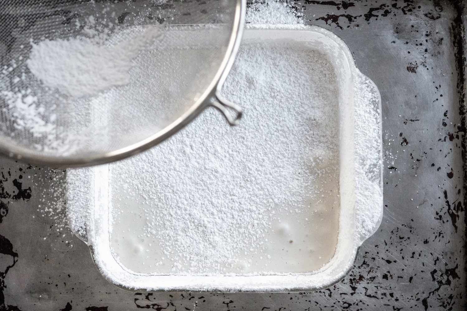 Baking Pan of Vegan Marshmallow Mixture Dusted with More Powdered Sugar and Cornstarch Mixture 