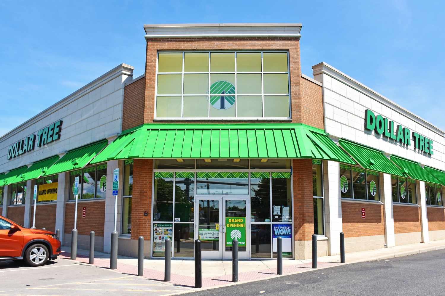 The exterior of a Dollar Tree store, featuring a brick facade and green signage
