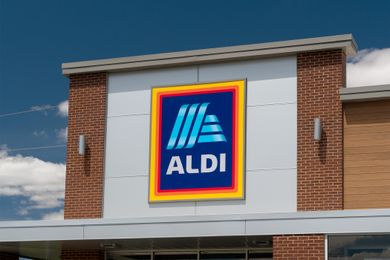 A sign for an Aldi grocery store on a building