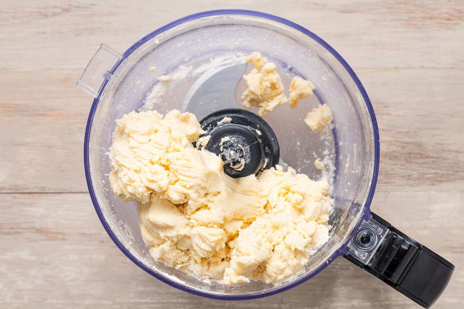 Butter mixture after pulsed in a food prcessor for pecan pie cookie recipe