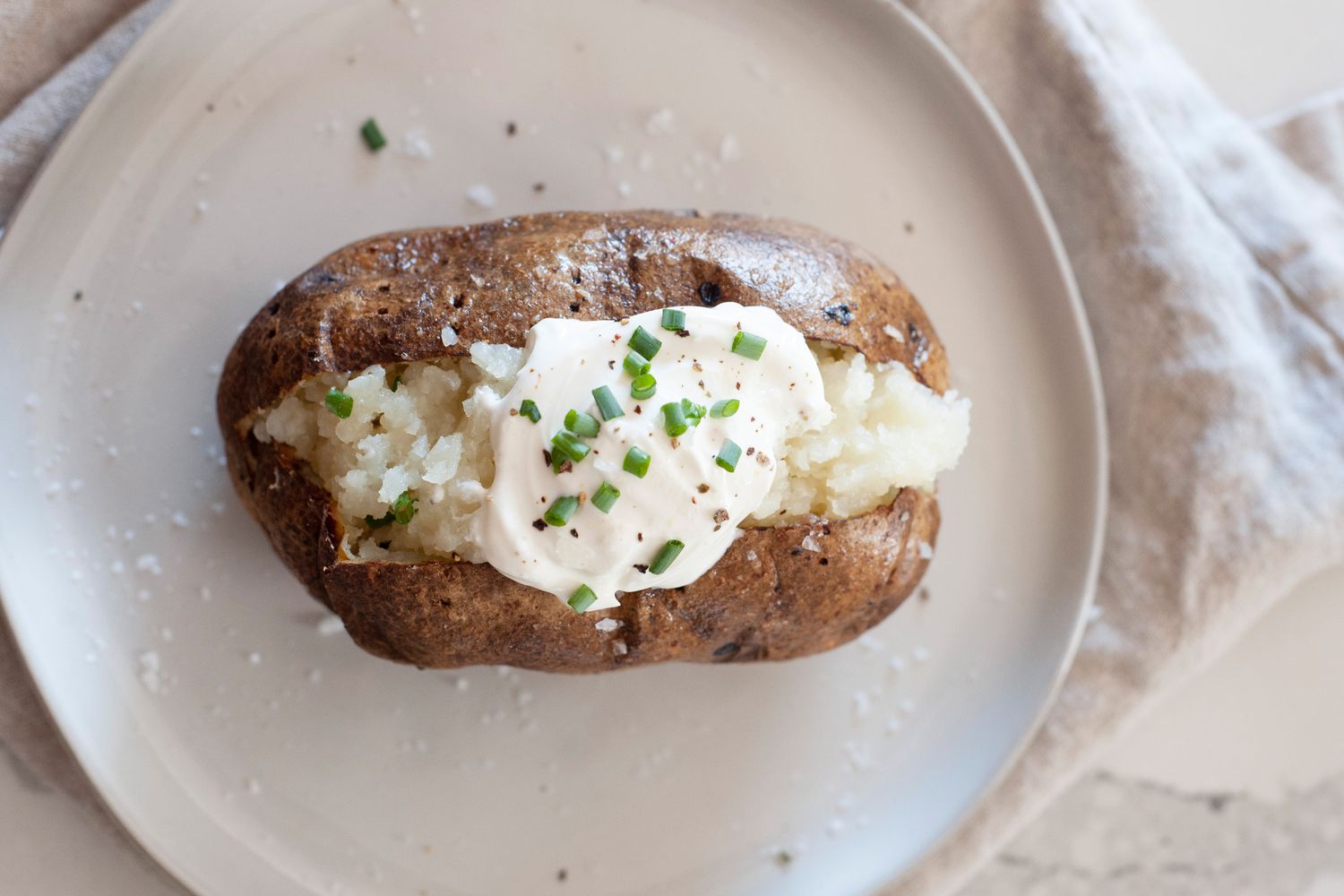 Air Fryer Baked Potatoes Topped with Sour Cream