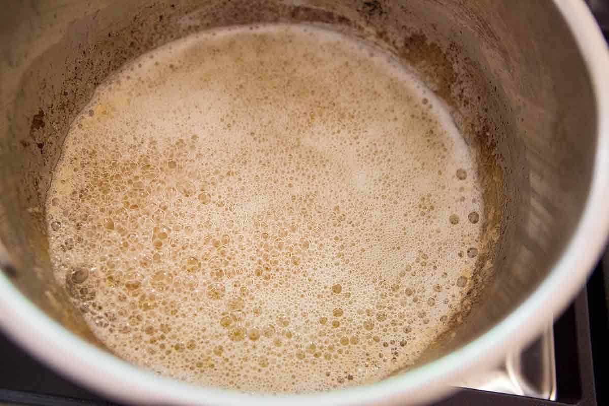 As the browned butter for the oatmeal chocolate chip cookies browns, foam will rise to the top