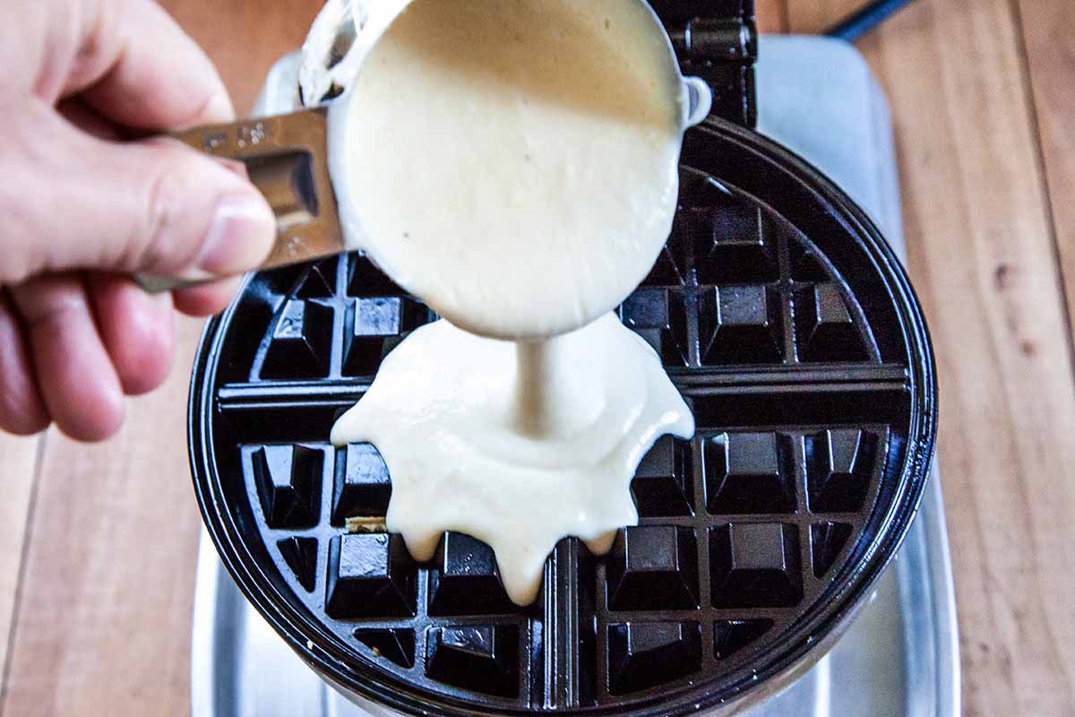 Best Belgian Waffle Recipe pour the batter in