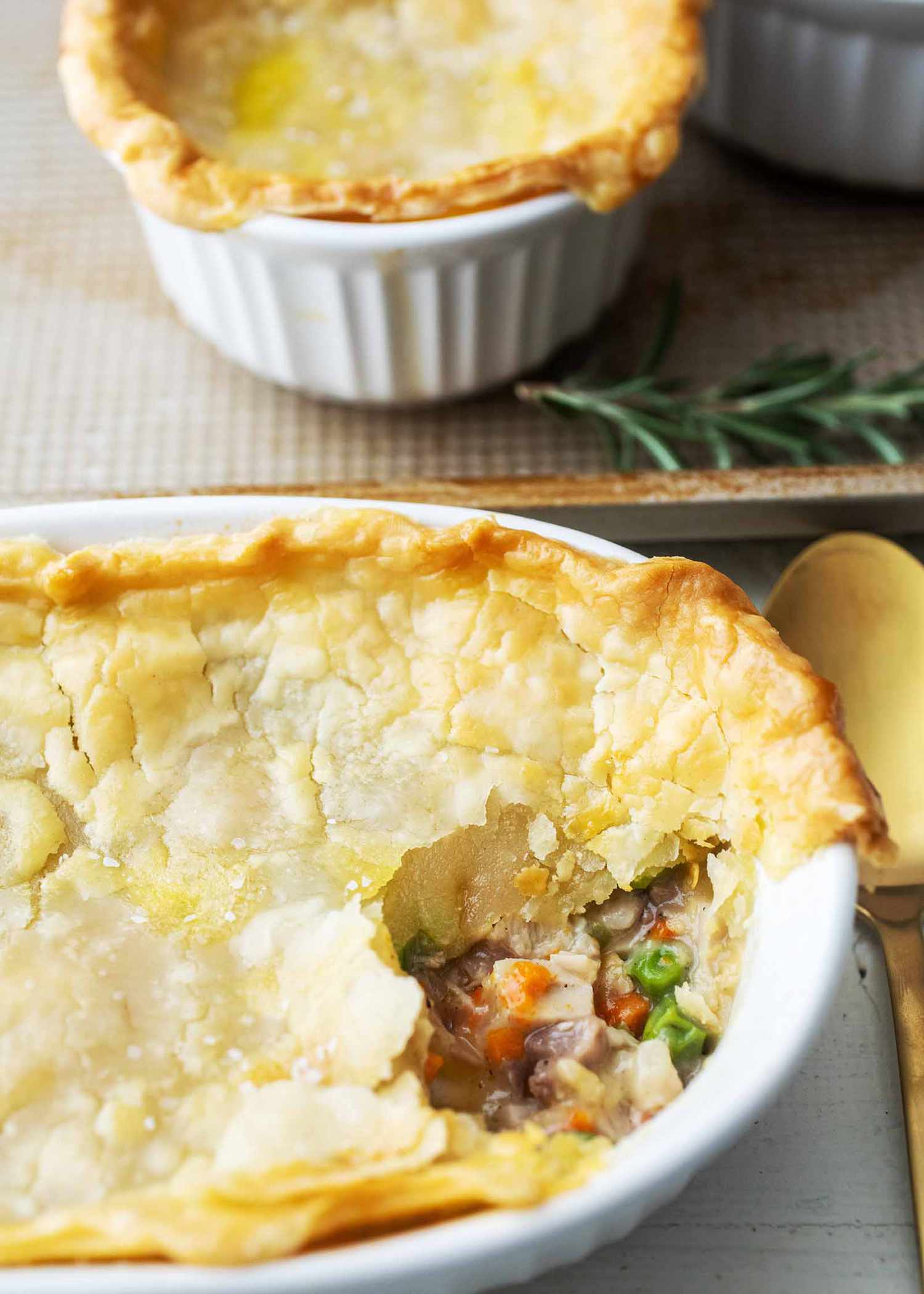Two casserole dishes of leftover turkey pot pie