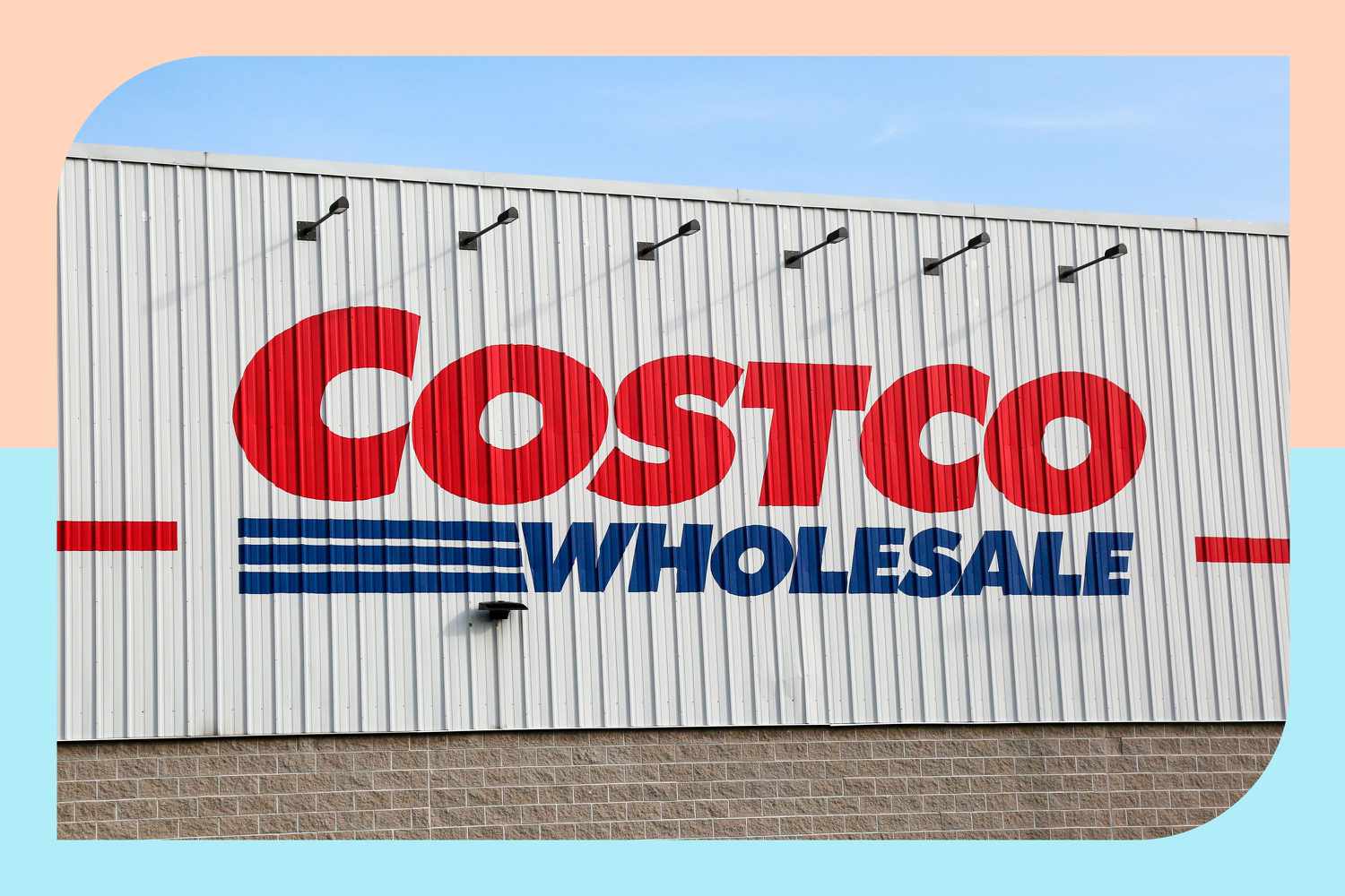 A Costco Wholesale sign on the side of a warehouse