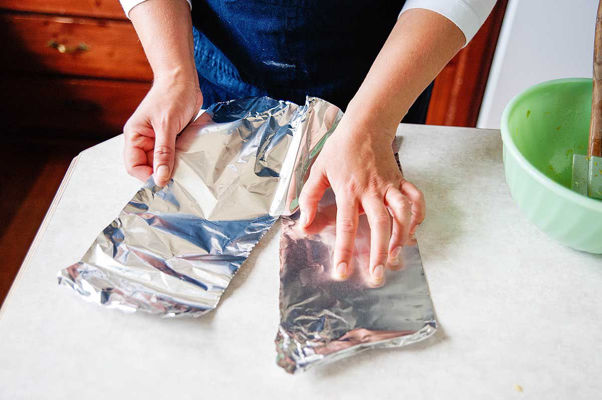 Old Fashioned Rhubarb Pie - - tearing aluminum foil in half