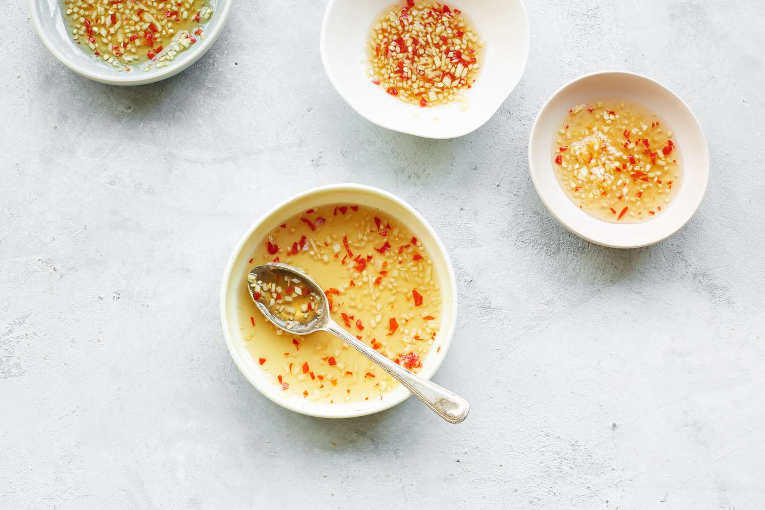 Bowls of Dipping Sauce for Chào Gá (Vietnamese Rice Porridge)