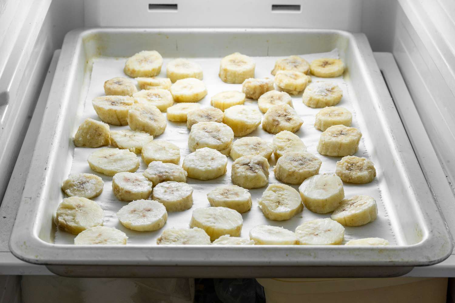 Sliced Banana on a Baking Tray in the Freezer for Banana Nice Cream Recipe