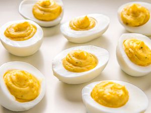 Deviled eggs with a ranch seasoning flavor, arranged on a surface