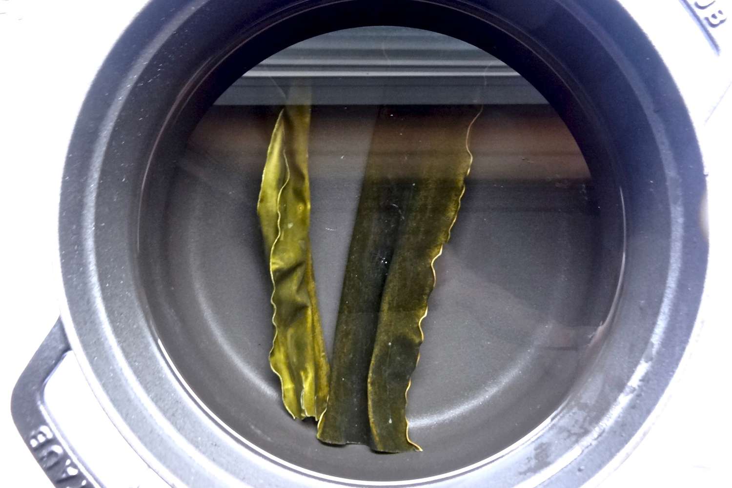 Soaking kombu in a large pot to make homemade miso.