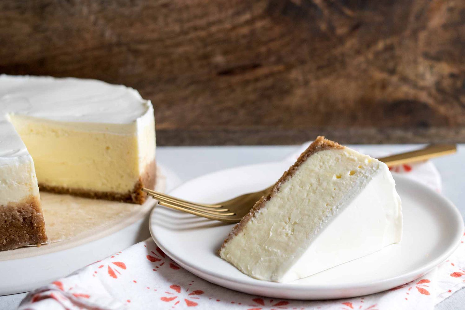 Slice on Instant Pot cheesecake on a plate with a fork