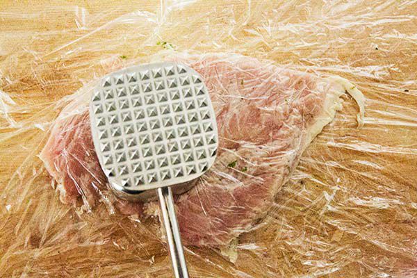 chicken being pounded down