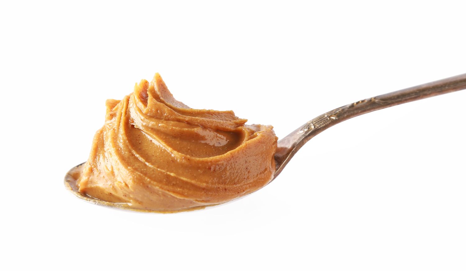 A spoon with a dollop of peanut butter