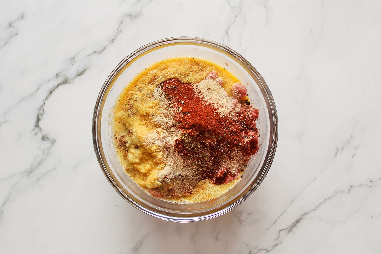 Making Pulpeta (Cuban Meatloaf) in a glass bowl.