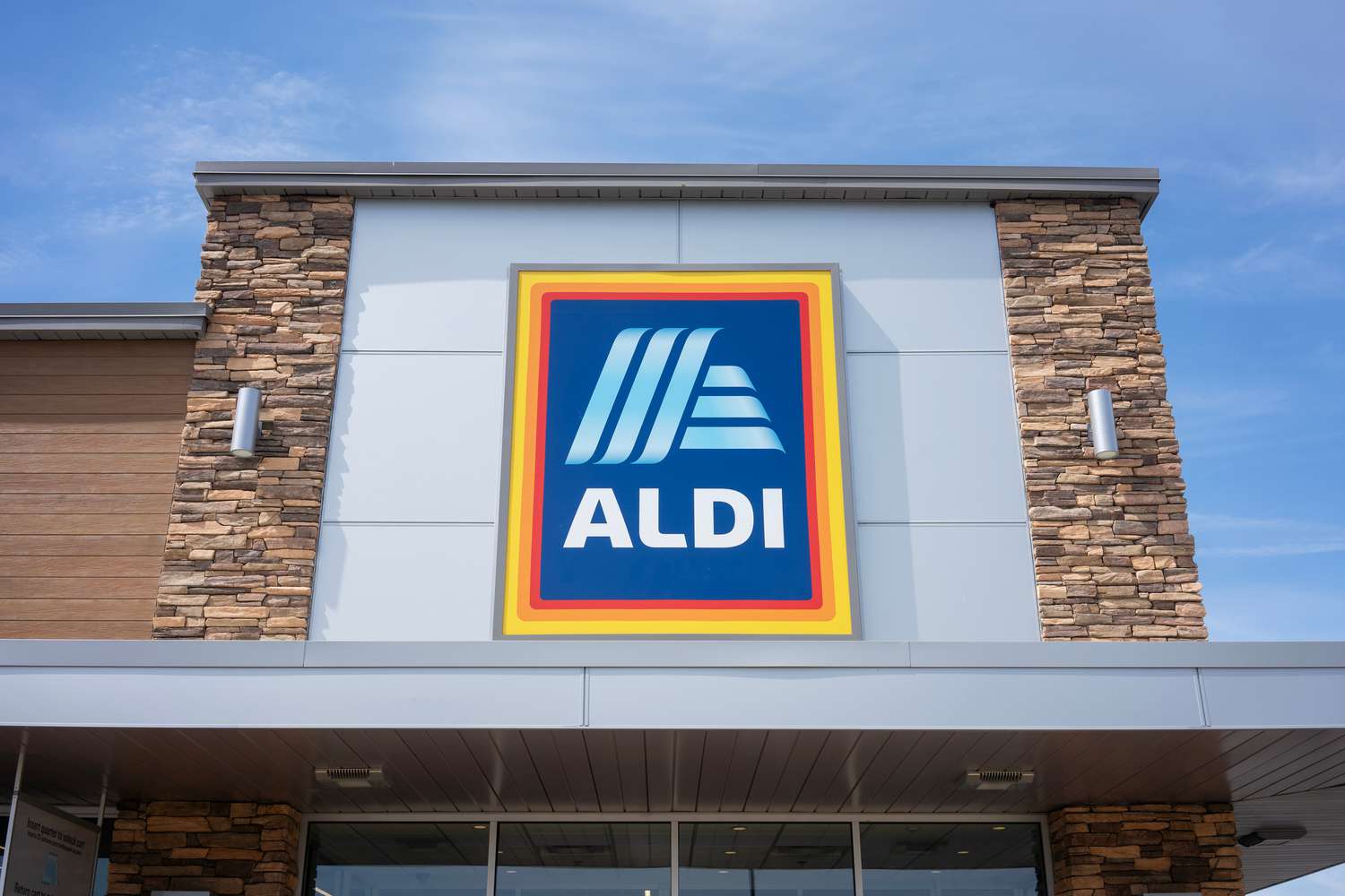 Outside view of an ALDI store with a large ALDI sign