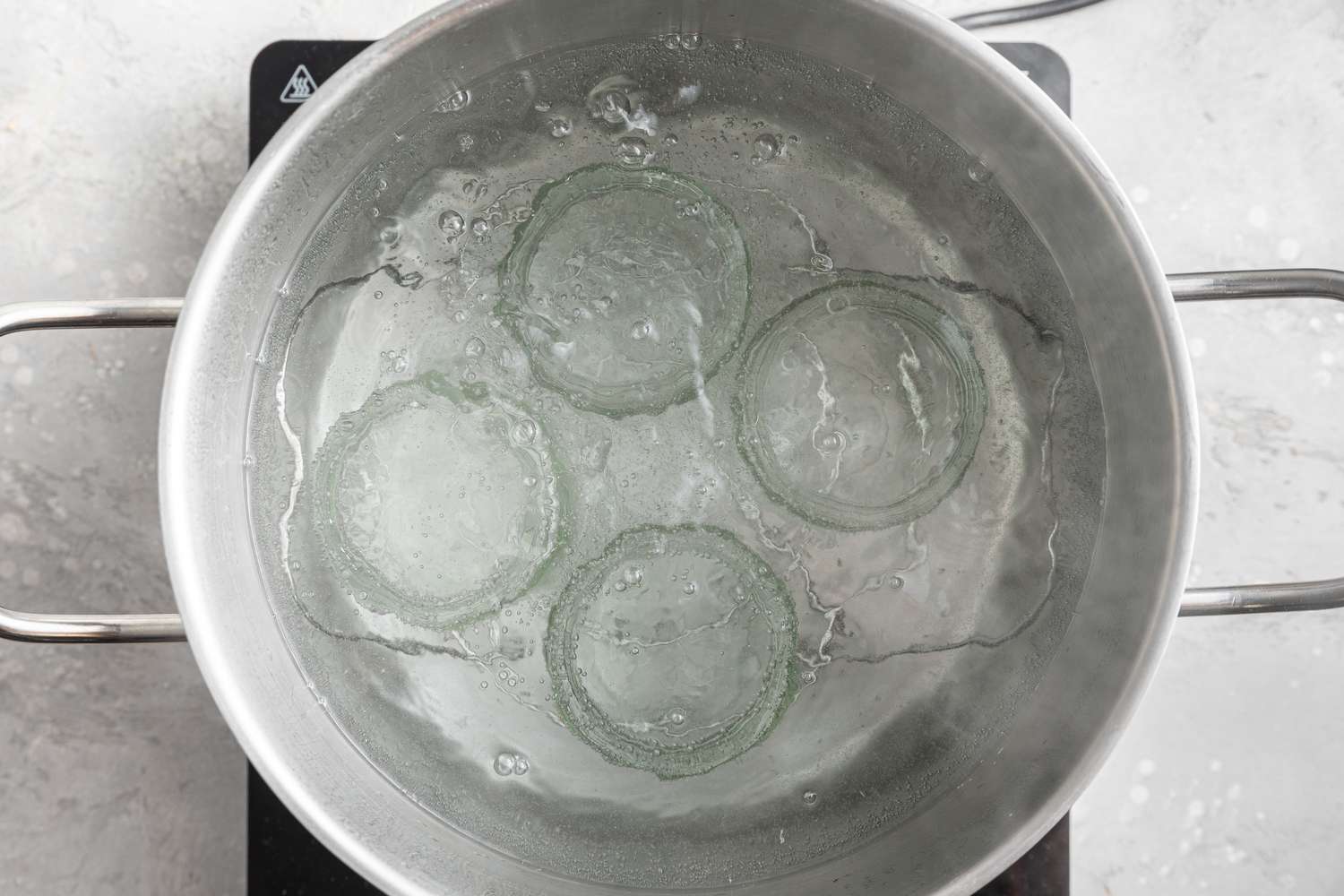 Glass jars in a pot, Boiling in Water 