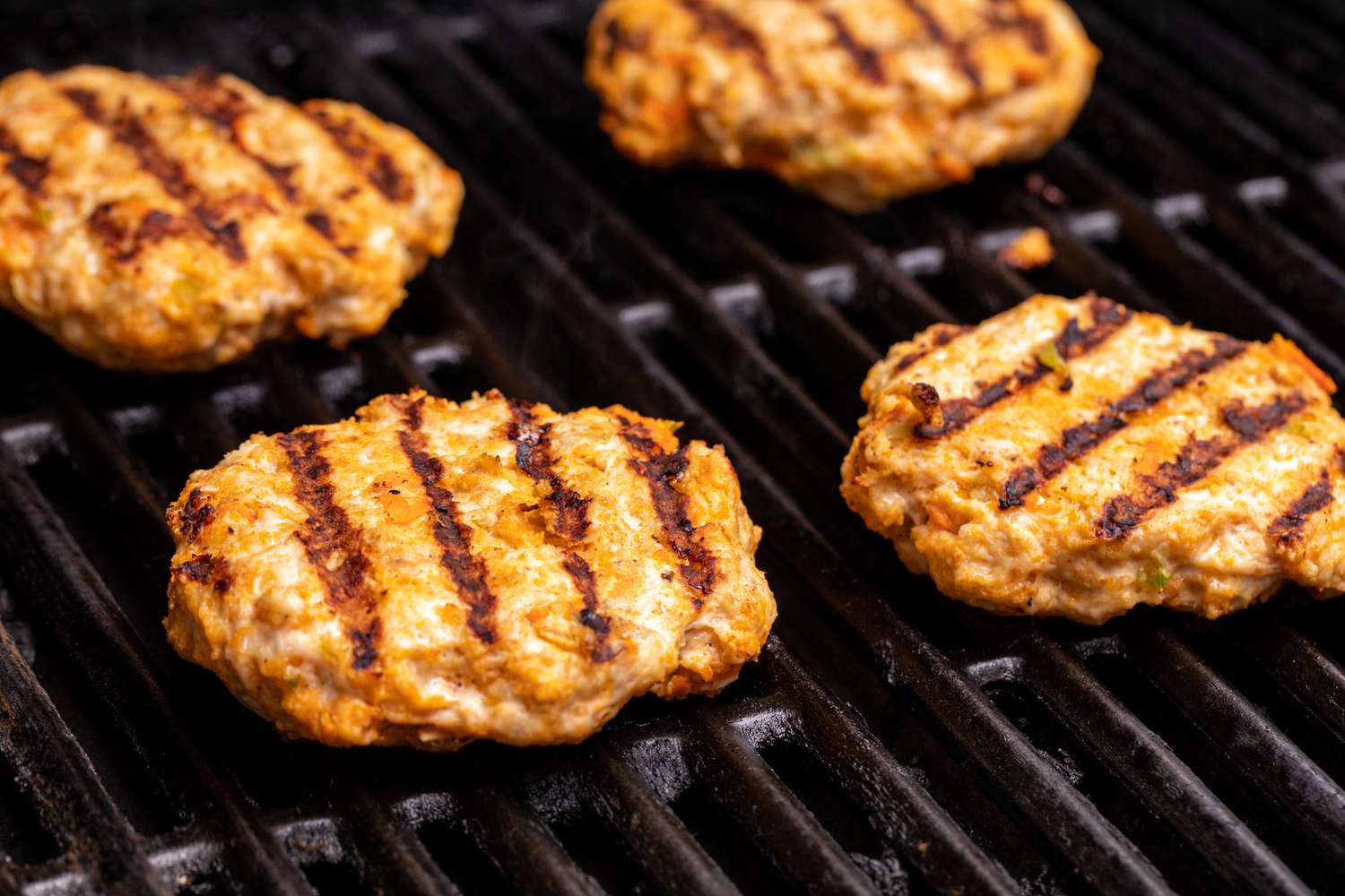 Grilling Buffalo chicken burgers.