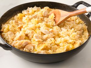 Side vew of one pot chicken and rice in a cast iron pot 
