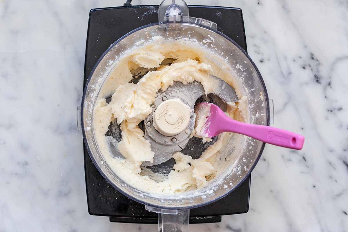 Skillet Cake with Rhubarb - rhubarb cake batter in food processor with pink spatula