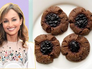 Giada De Laurentiis next to a plate of cookies with a jam center