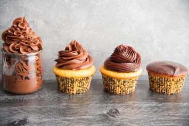 Side view of different ways to decorate cupcakes using the perfect chocolate ganache recipe
