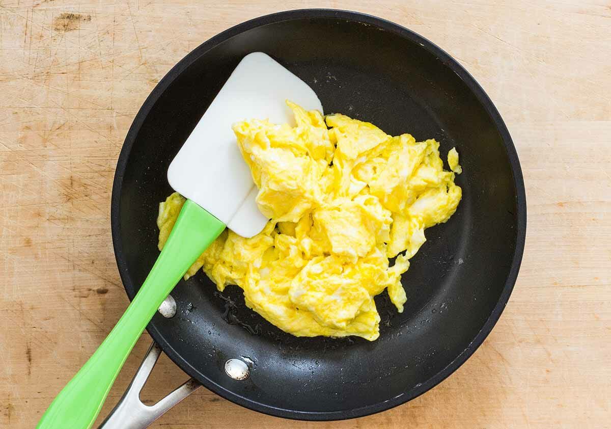 scramble the eggs for making Singapore Style Noodles with Shrimp