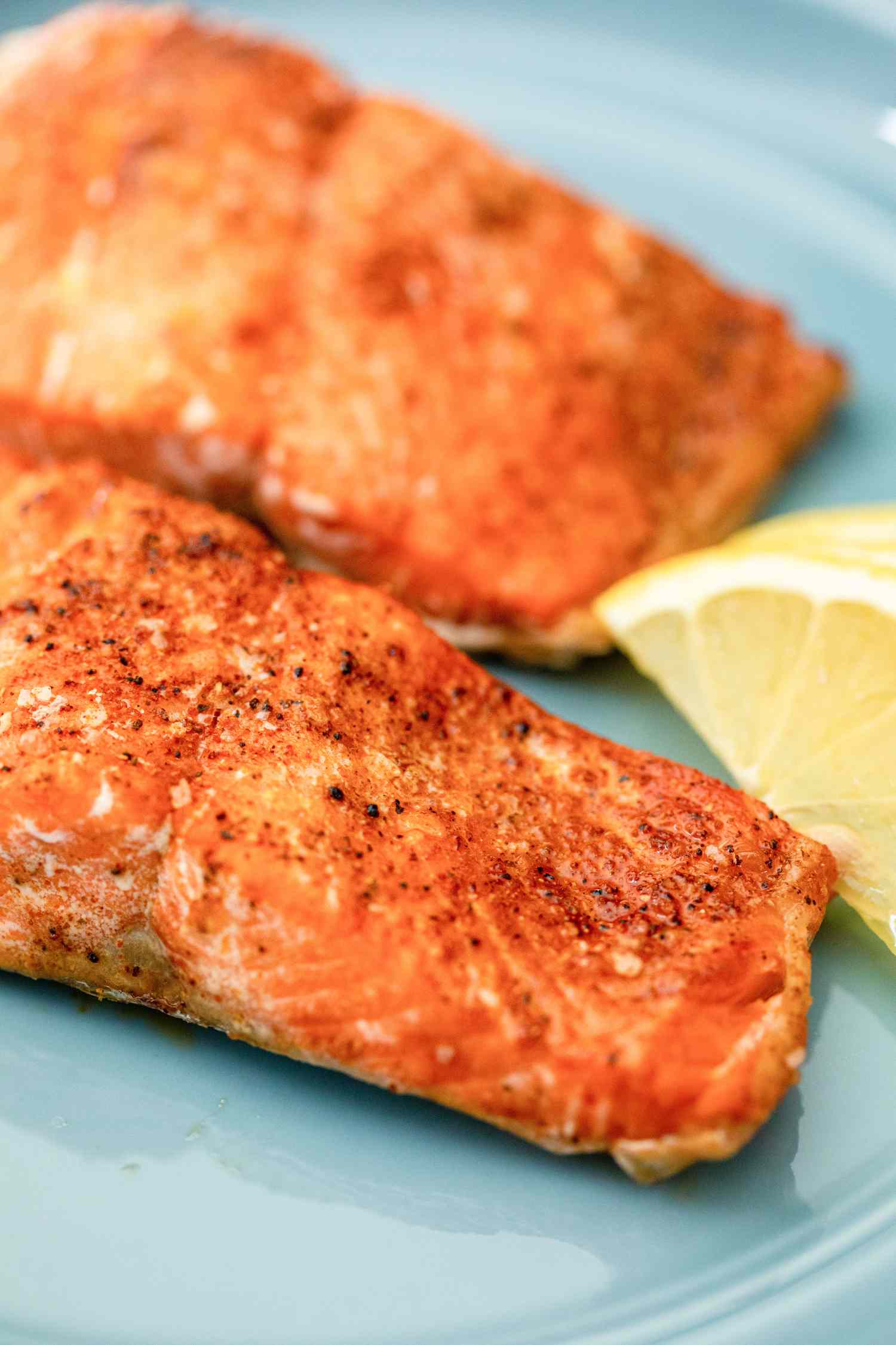 Air Fryer Salmon on a Plate with Lemon Slices