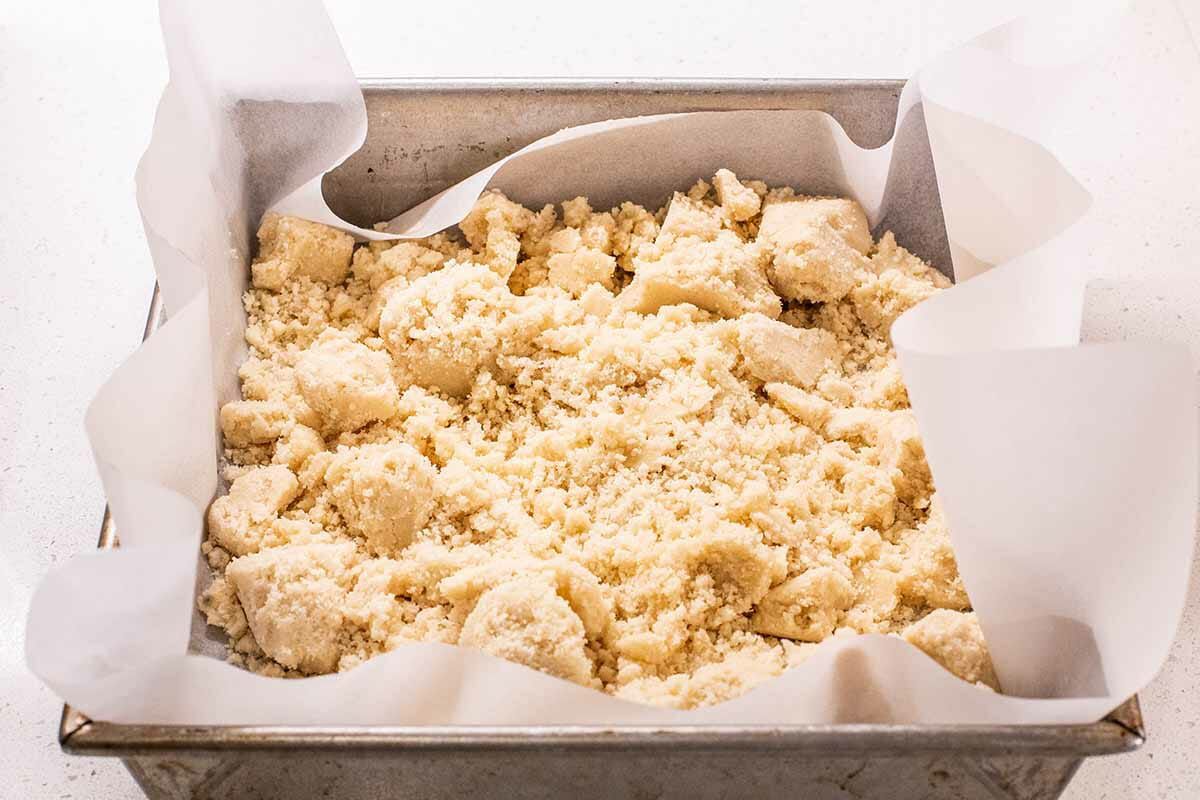 Best Ever Pecan Pie Bars add crust to pan