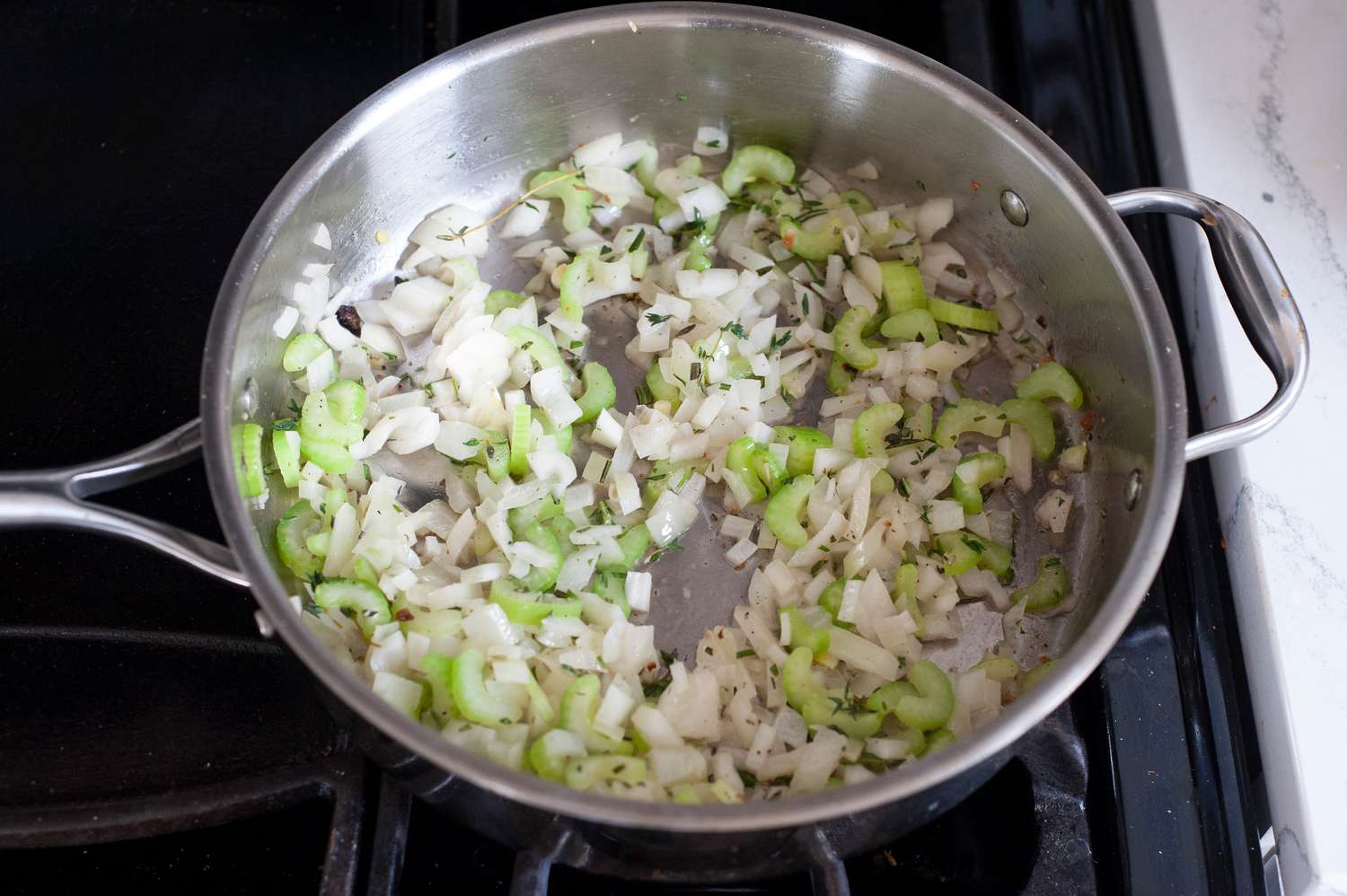 Sauté vegetables in skillet.