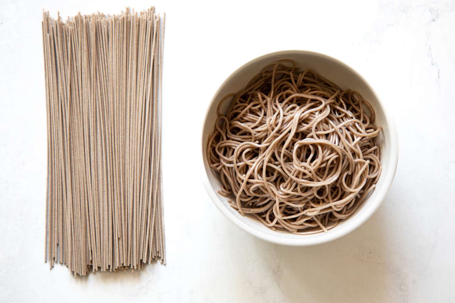 Dried Soba on the Left and Cooked Soba in a Bowl on the Right
