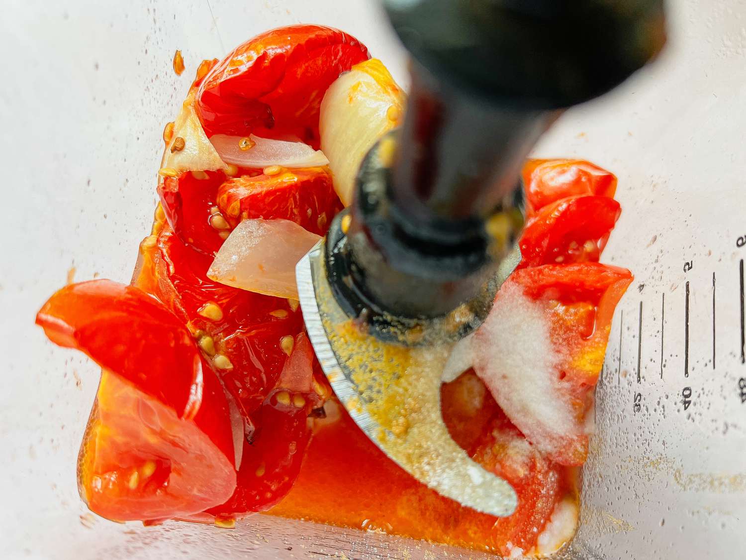 Roasted Vegetables and Seasoning in a Blender for Pulled Pork Enchiladas Recipe