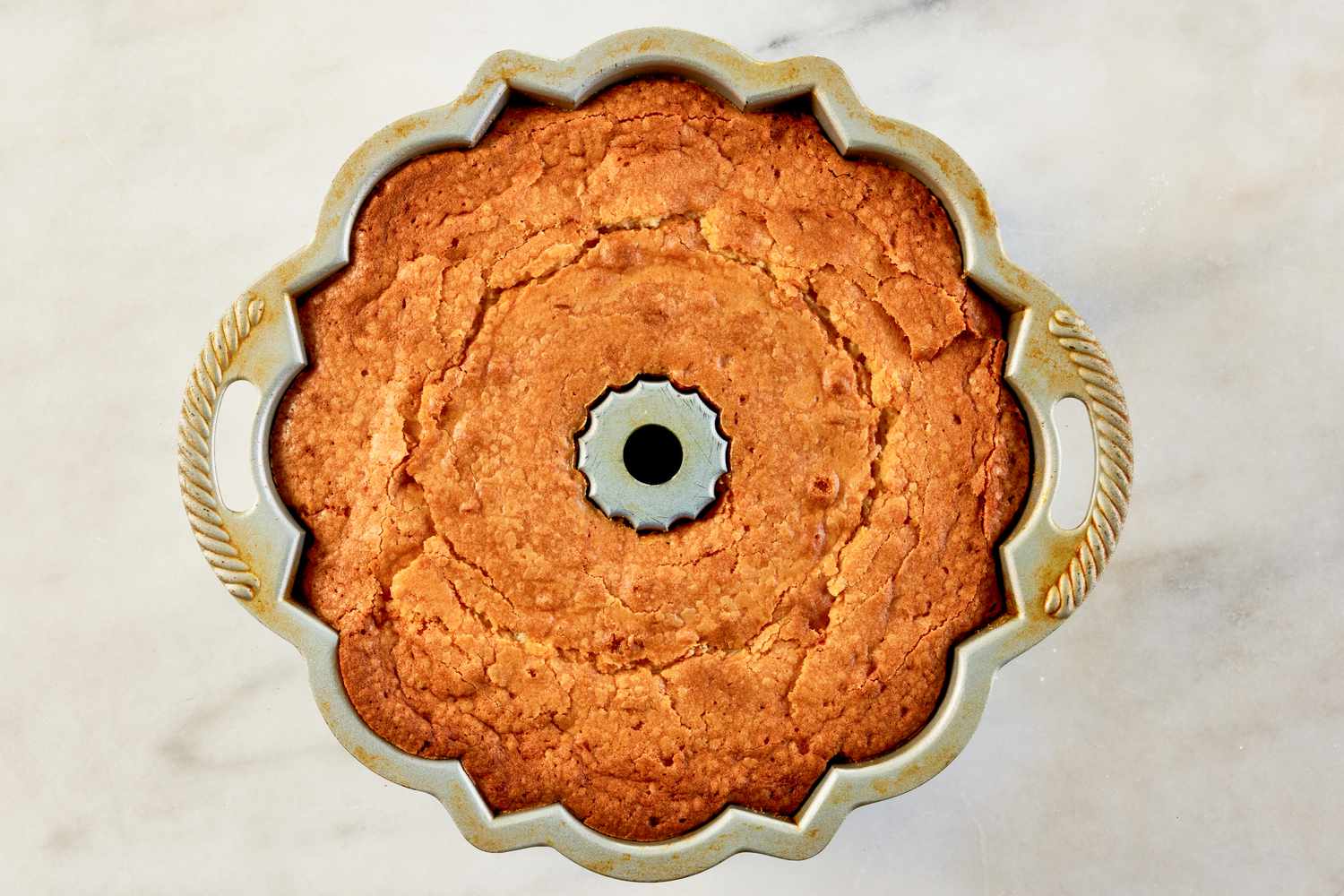 Baked cake cooling in the bundt pan for 7UP bundt cake recipe